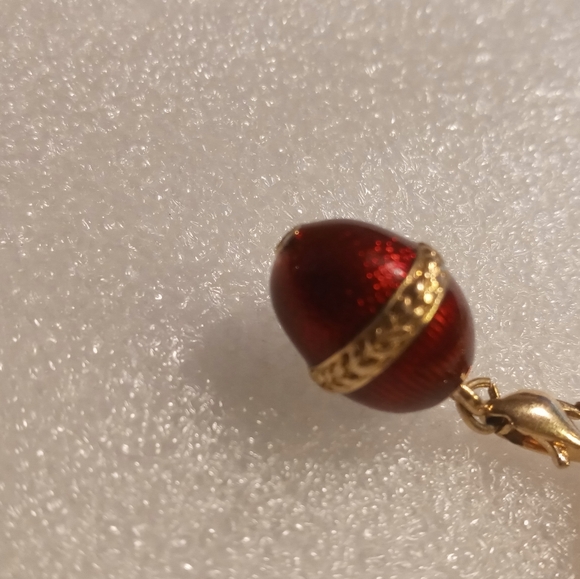 Faberge egg charm bracelet on a gold tone rolo chain. - Picture 11 of 16